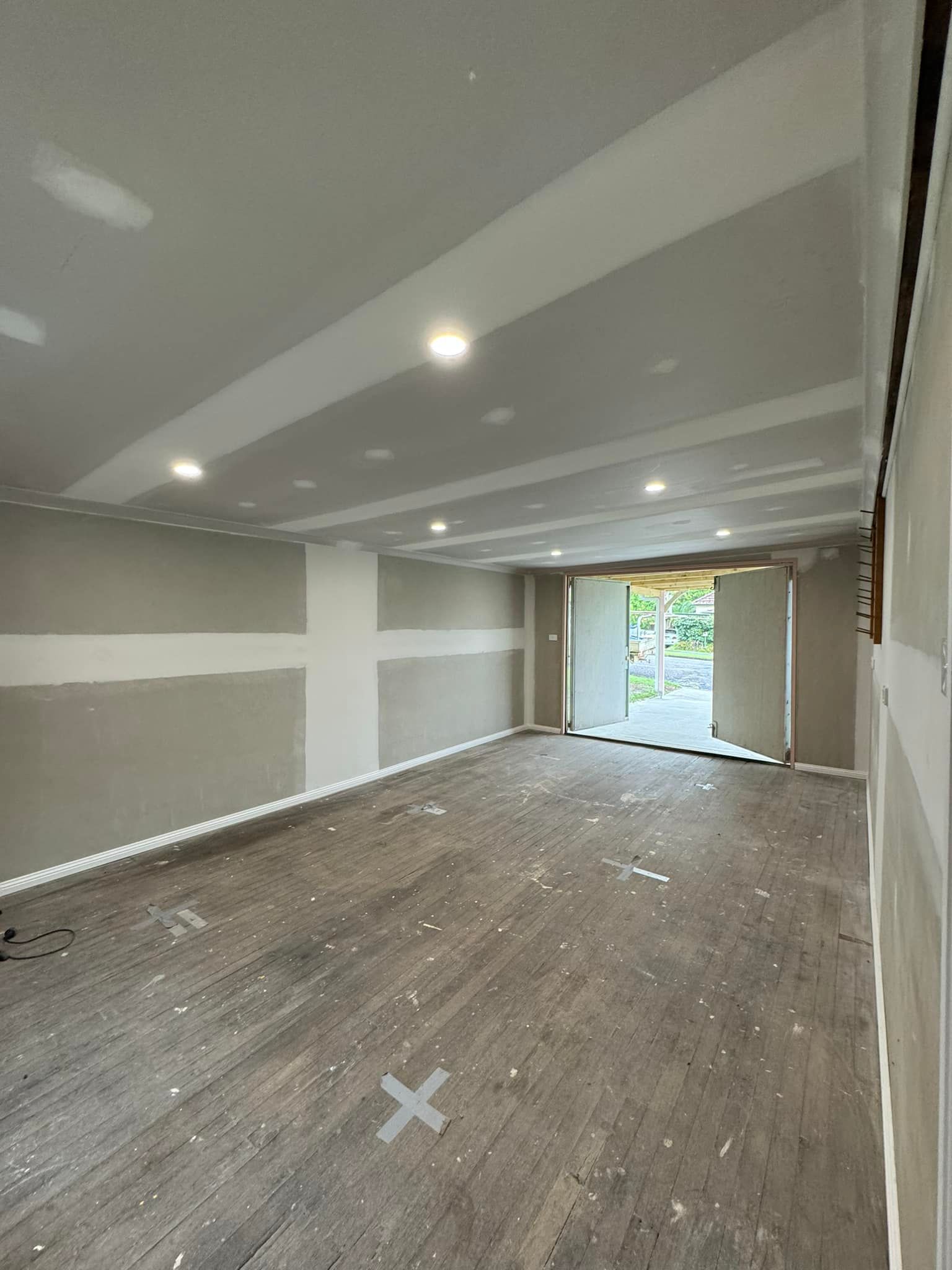 Interior of a Room Under Construction With Gray Walls — Alcando Renovations and Maintenance In Old Bar, NSW