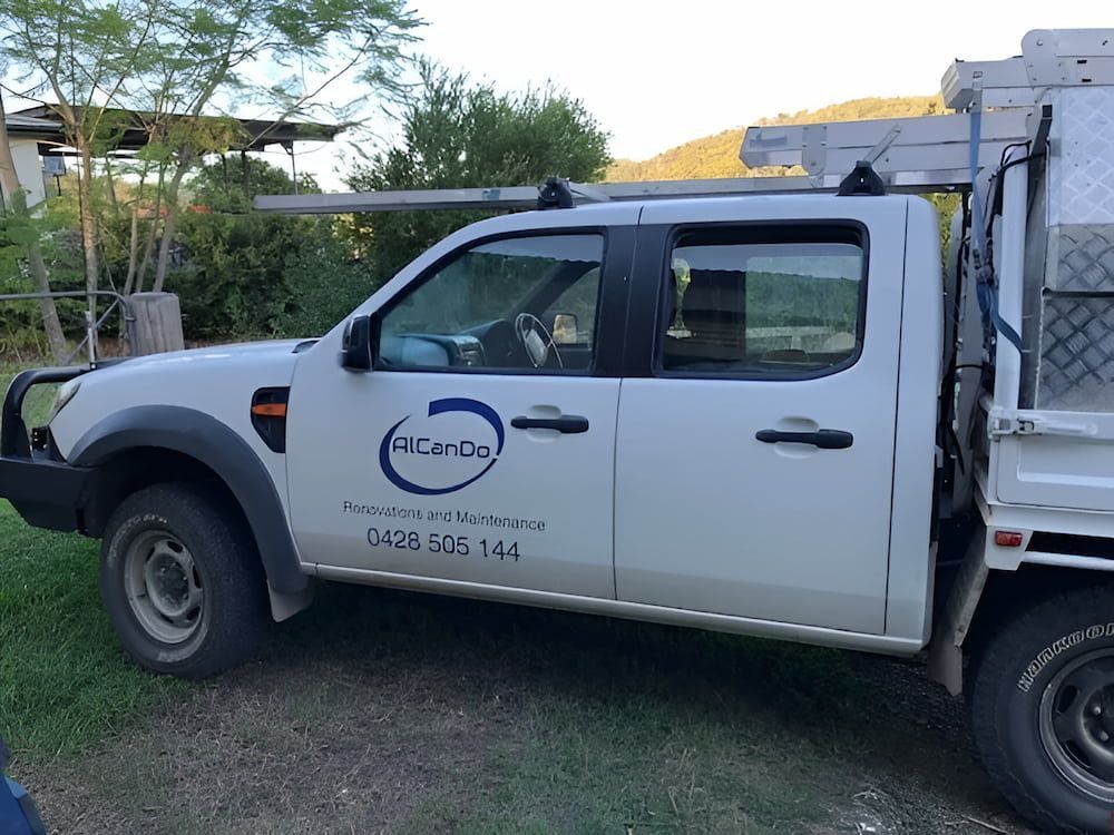 White Work Truck With Logo, Parked on Grass — Alcando Renovations and Maintenance in Bobin, NSW