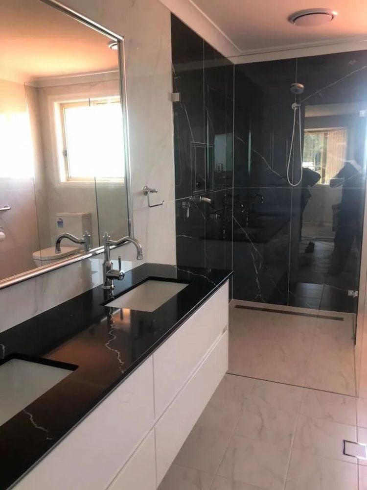 Modern Bathroom With Black and White Accents — Alcando Renovations and Maintenance in Bobin, NSW