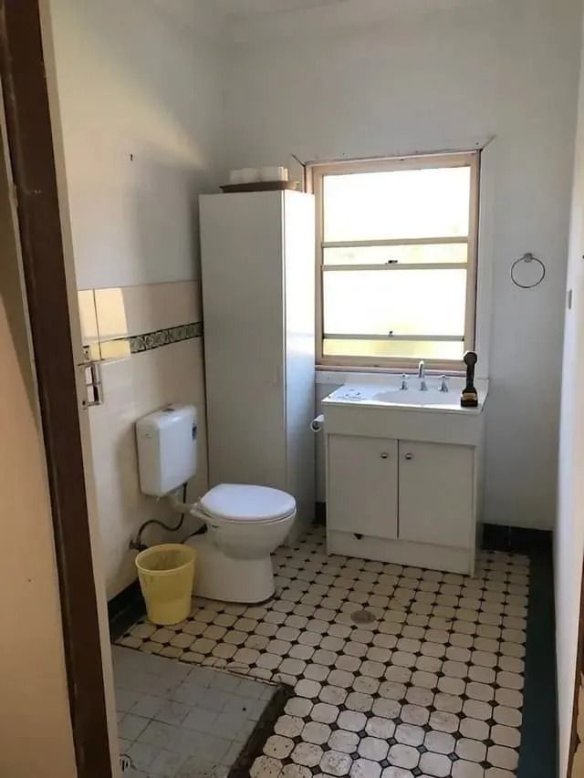 Bathroom With Toilet, Sink, and Storage Cabinet — Alcando Renovations and Maintenance In Bobin, NSW