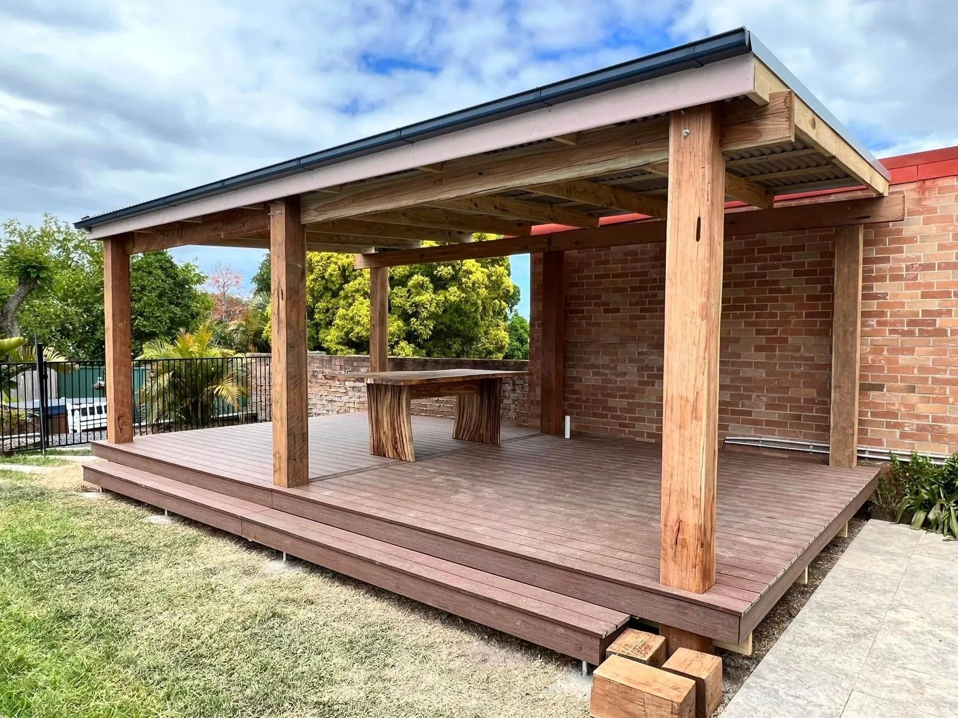 Wooden Pergola With a Deck and Brick Wall — Alcando Renovations and Maintenance In Bobin, NSW