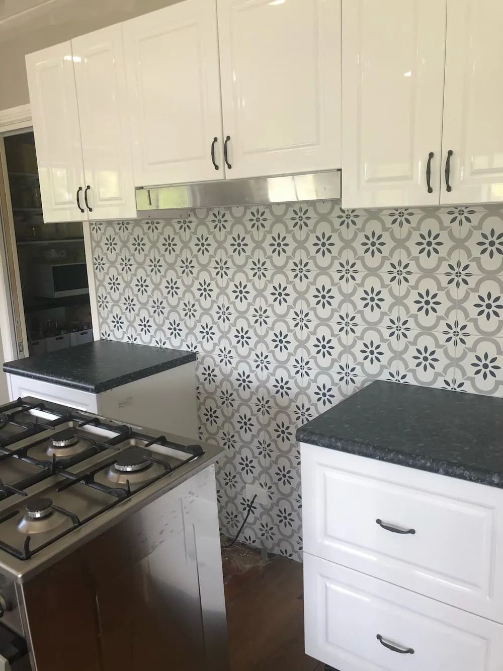 Kitchen With White Cabinets, Patterned Tile Backsplash — Alcando Renovations and Maintenance In Bobin, NSW