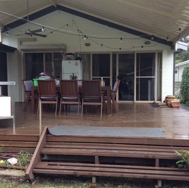 Covered Patio With Dining Table, Chairs, and Sliding Glass Doors — Alcando Renovations and Maintenance In Forster, NSW
