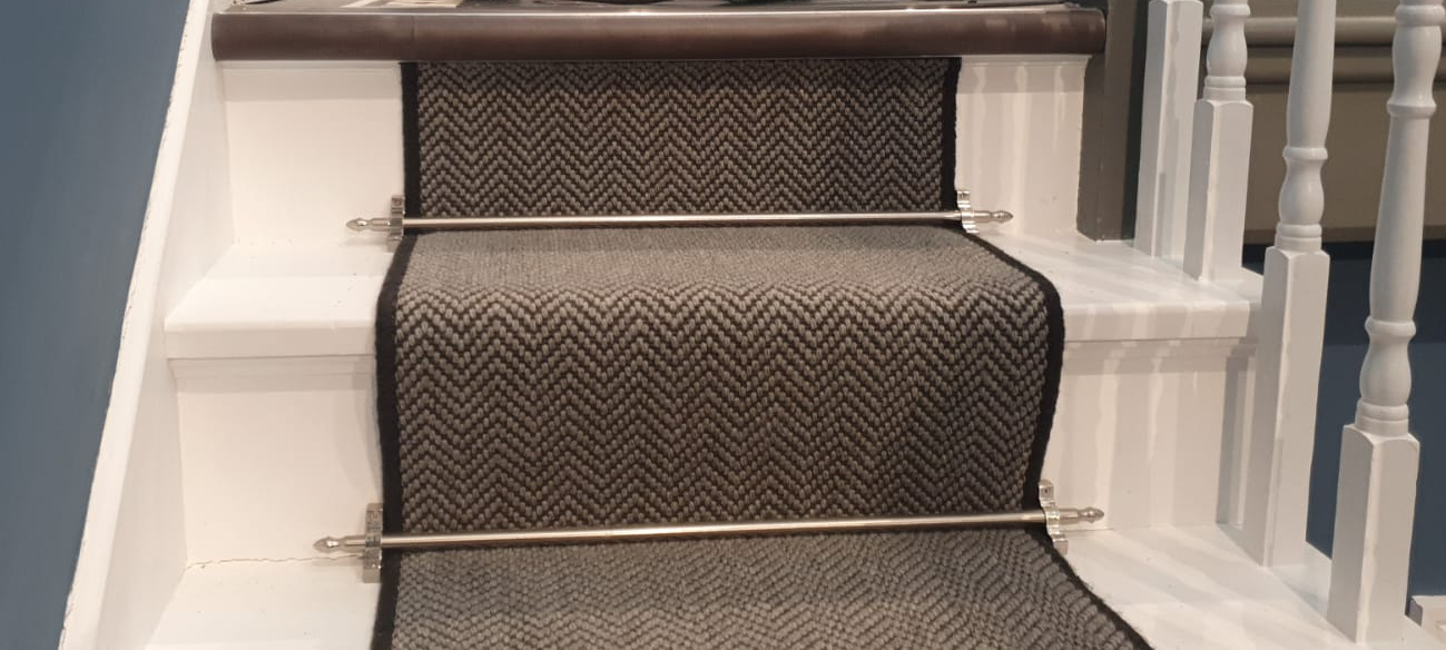 A close up of a staircase with a carpet on it.