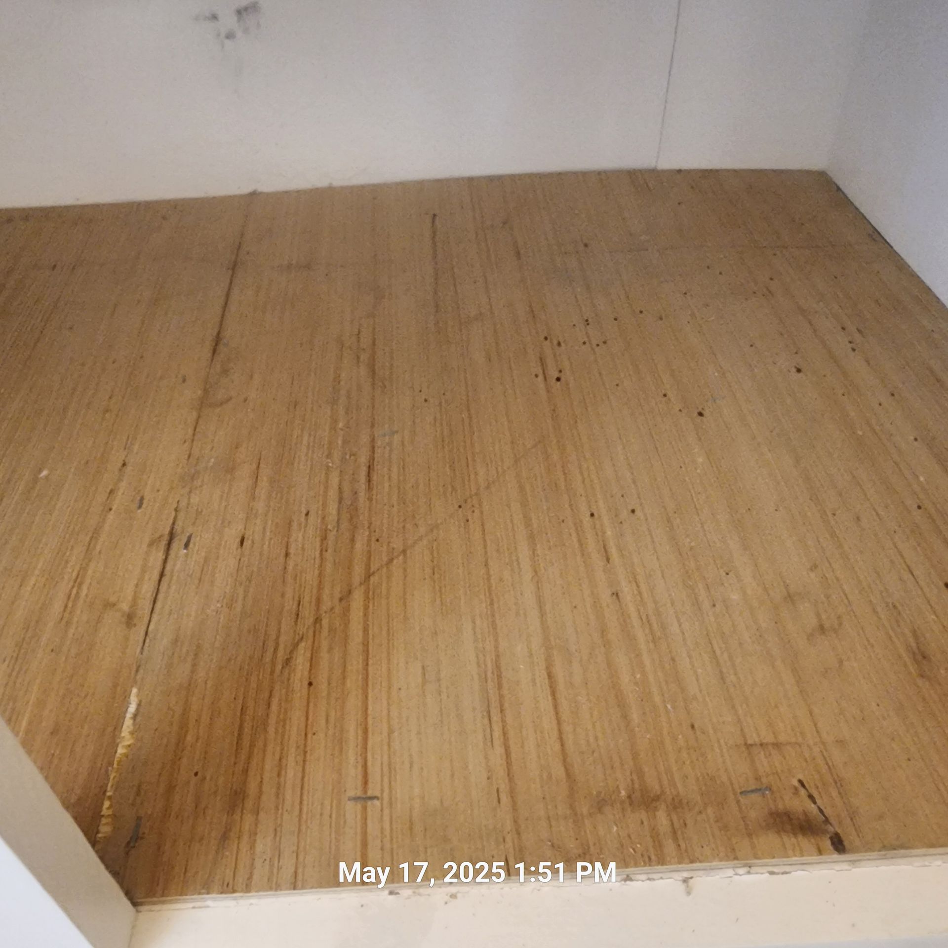 A picture of a wooden floor taken on may 17th at 1:51 pm