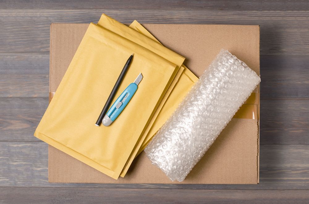 Packing Materials Like Cutter and Paper Are Placed on Floor — Huskisson Self Storage in Huskisson, NSW