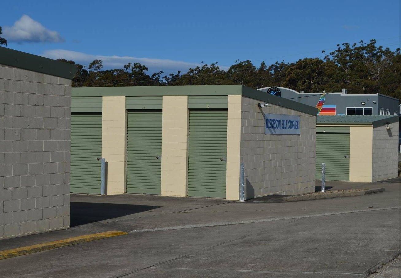 A Row of Storage Units With a Sign That Says — Huskisson Self Storage in Huskisson, NSW