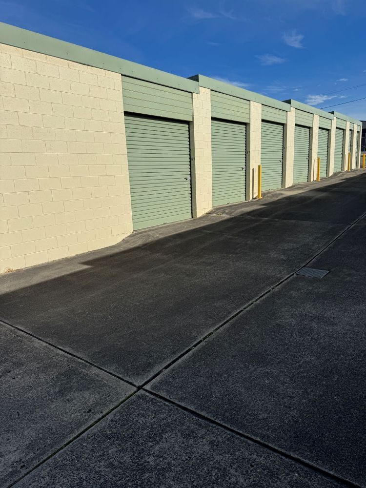 A Row of Garage Doors Are Lined Up in a Parking Lot — Huskisson Self Storage in Erowal Bay, NSW