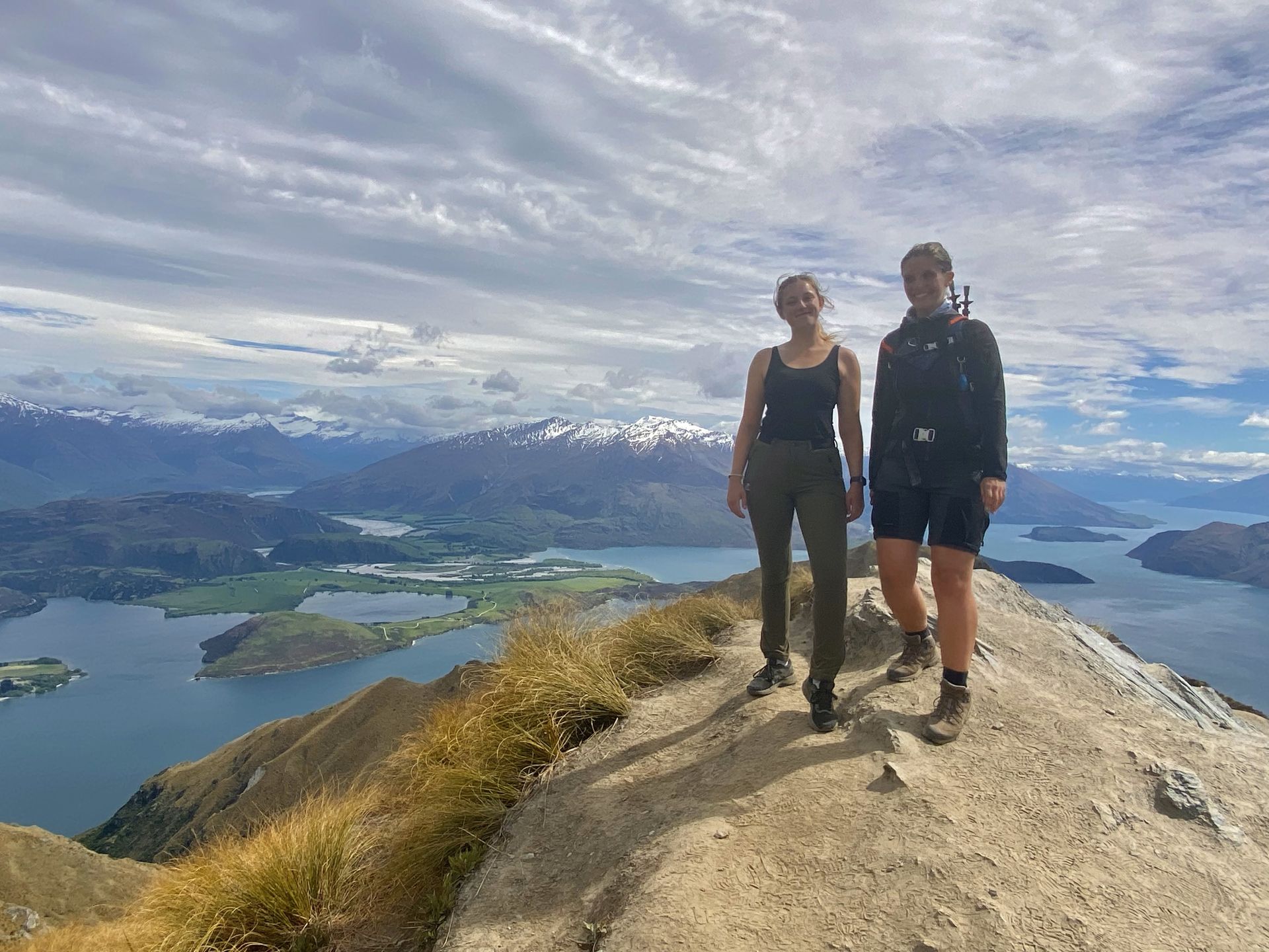 A large house with a swimming pool in front of it