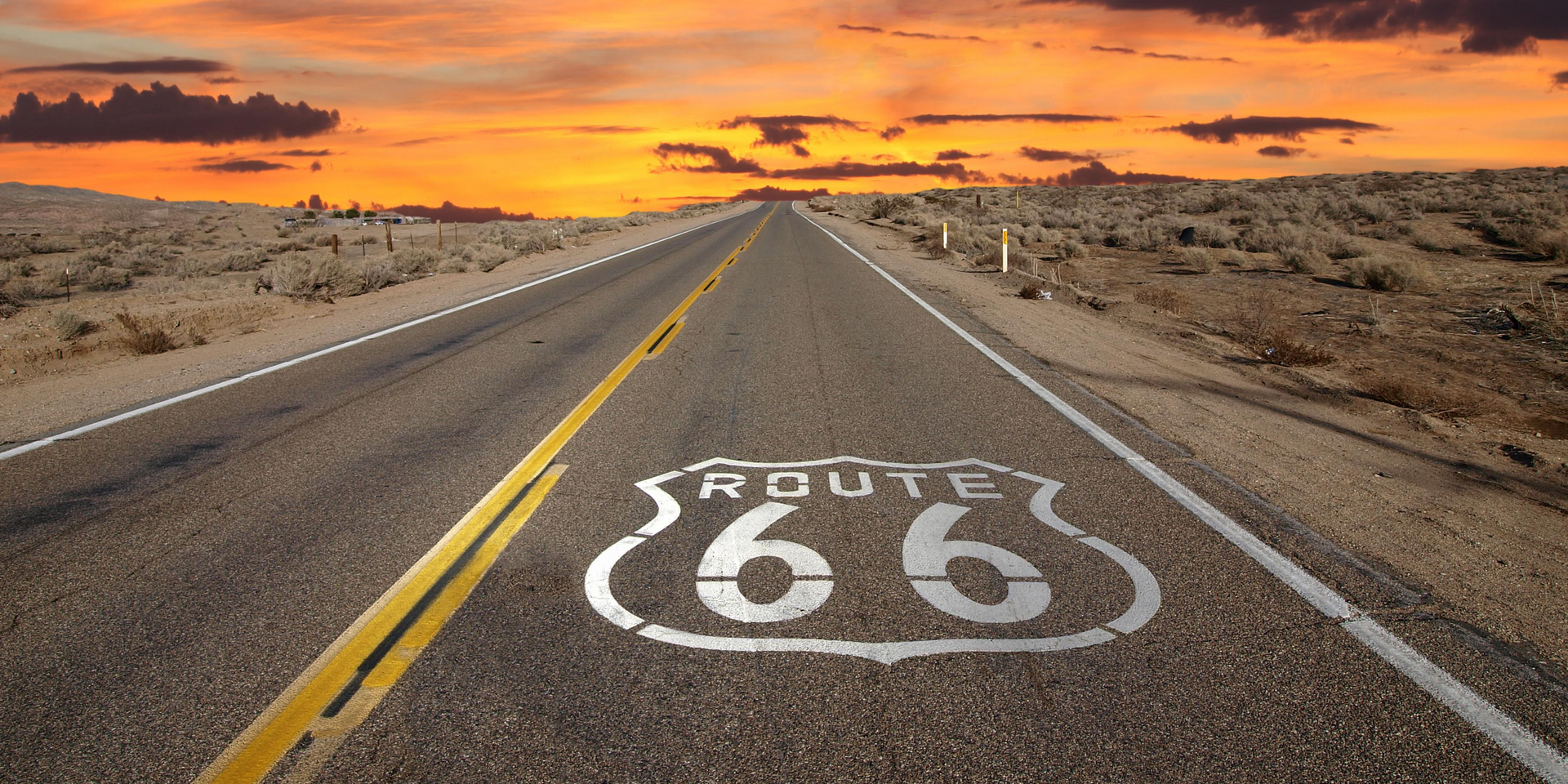 Route 66 is painted on the side of the road