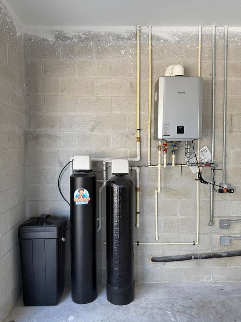 Blue water filtration system with digital control panel.
