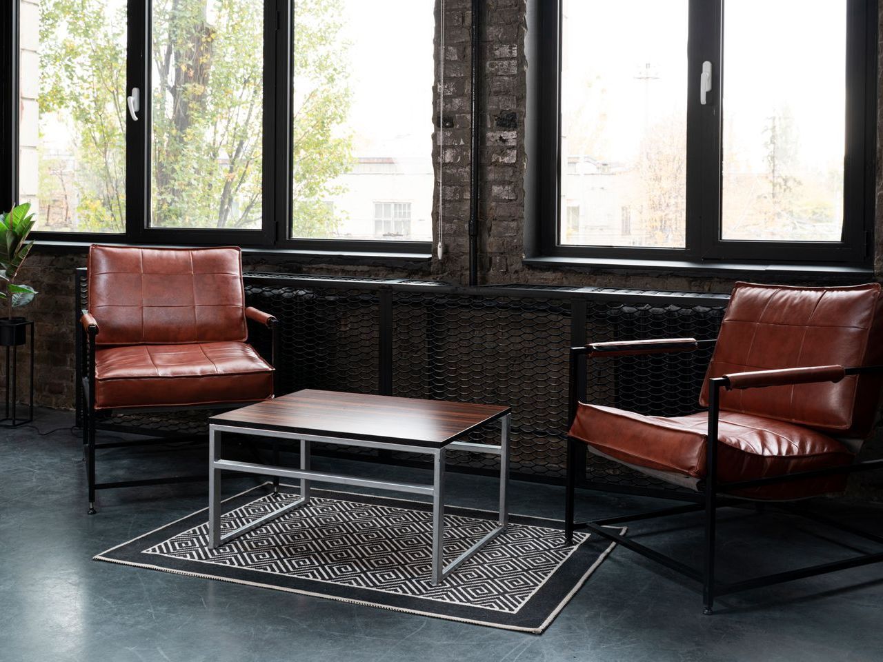 There are two chairs and a coffee table in the room.
