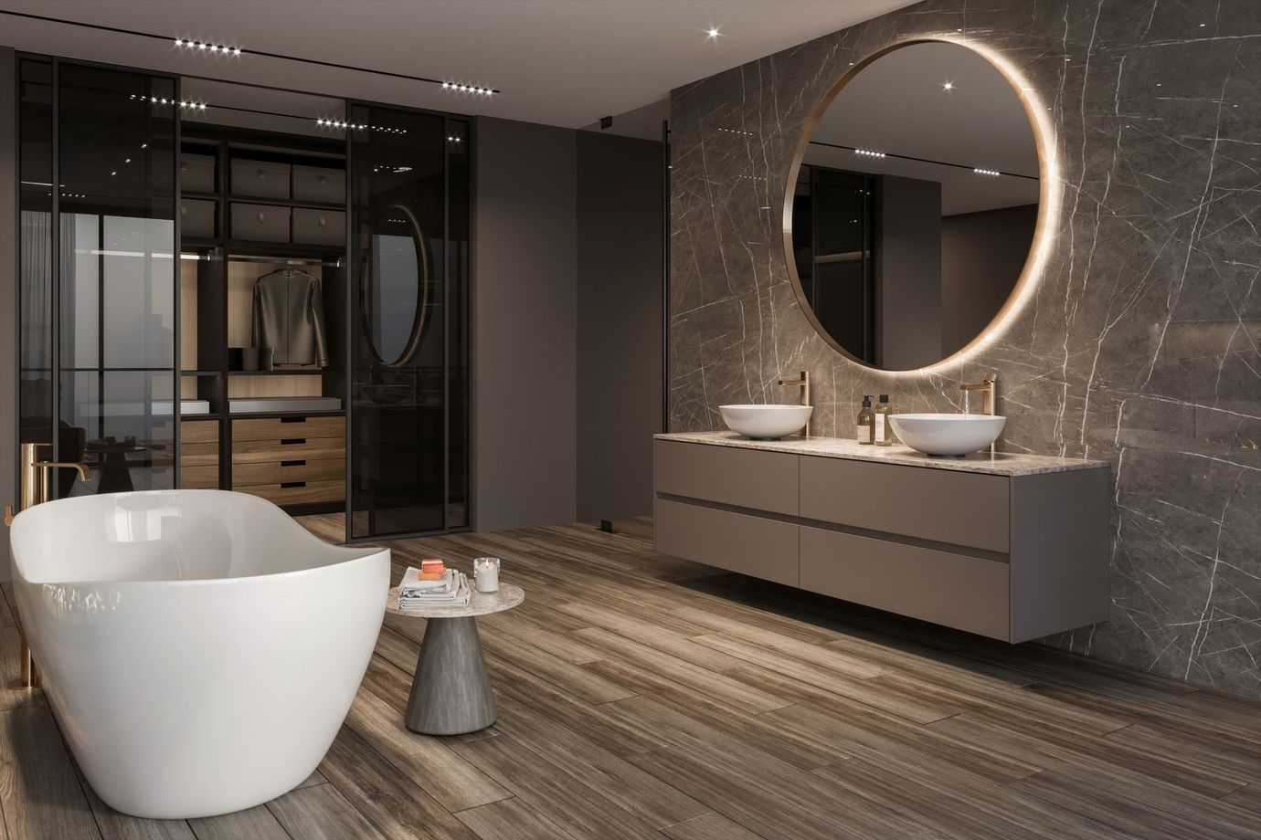 Bagno moderno con vasca bianca, specchio rotondo e mobiletto grigio.