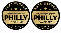 Two circular black-and-gold Philly Favorites badges, one labeled 2024 winner and one 2025 winner.