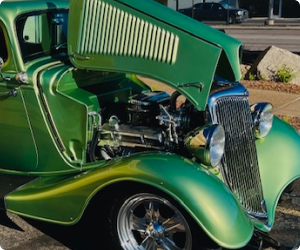Green vintage hot rod with hood open, showing engine. | Arizona Engine Rebuilding