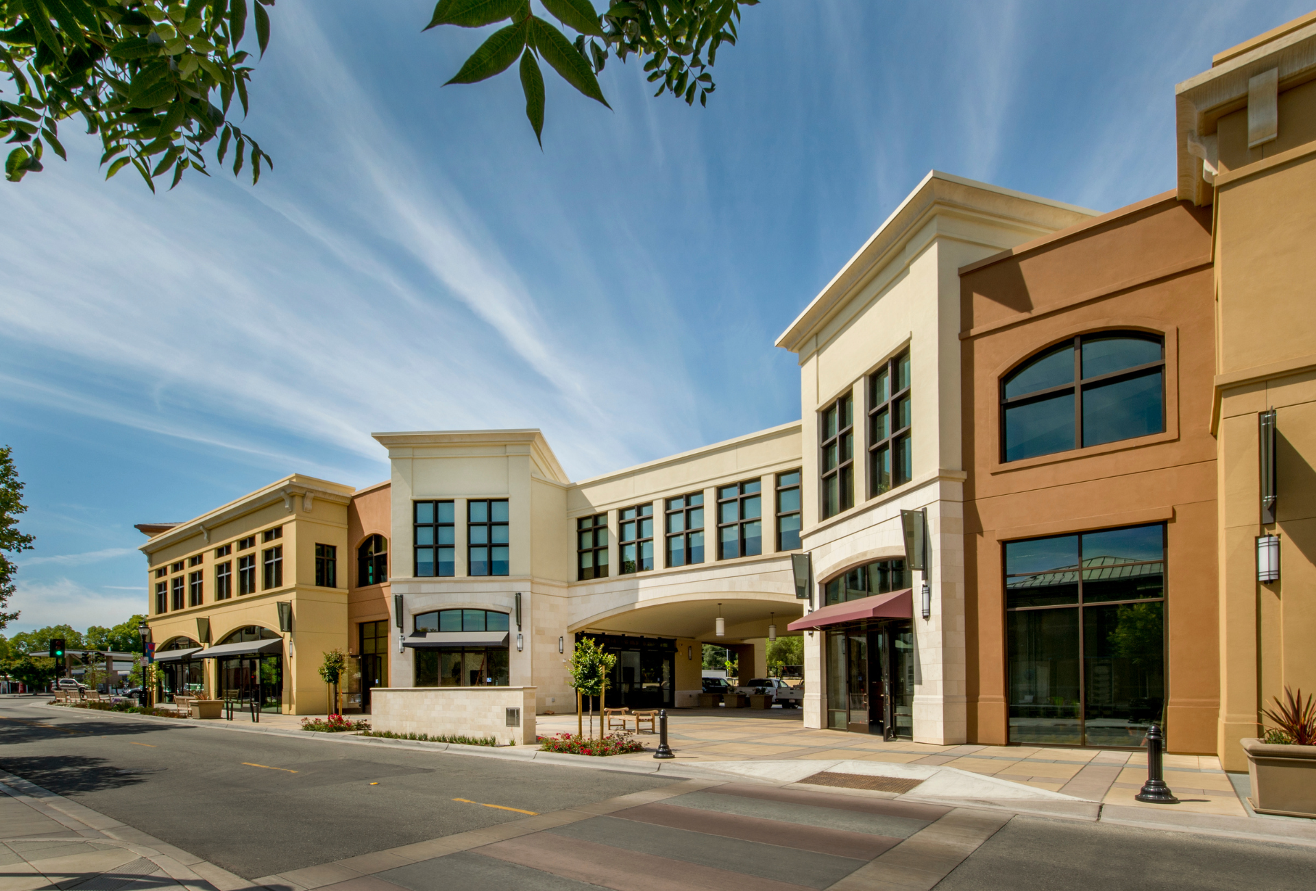 A large building with a lot of windows on a sunny day