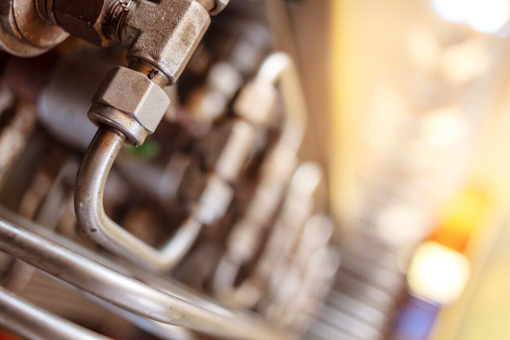A Close Up of a Metal Pipe on a Machine — Rock Plumbing & Gasfitting In Cannonvale, QLD
