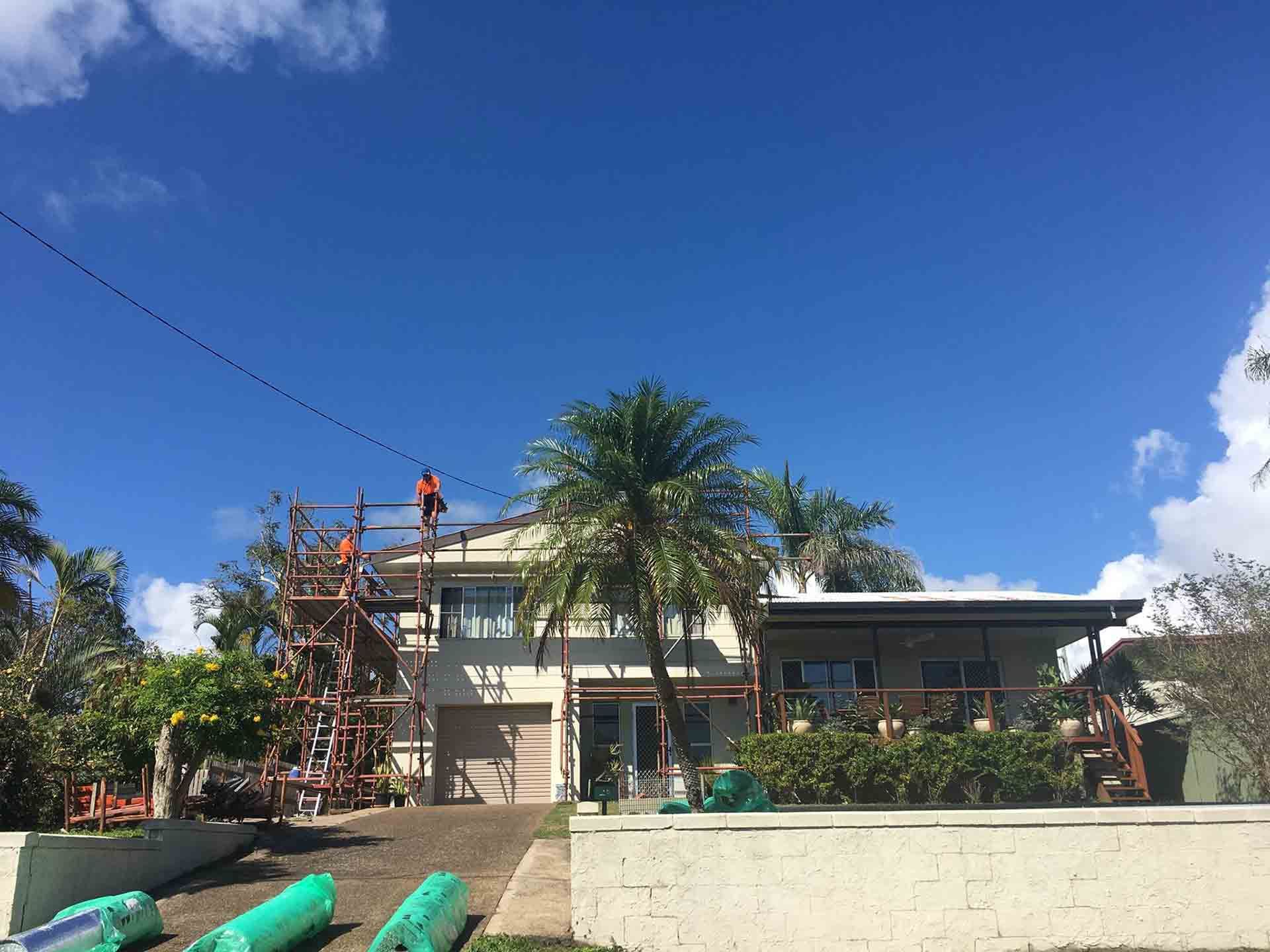 A Large Concrete Cylinder is Being Lifted by a Crane — Rock Plumbing & Gasfitting In Cannonvale, QLD