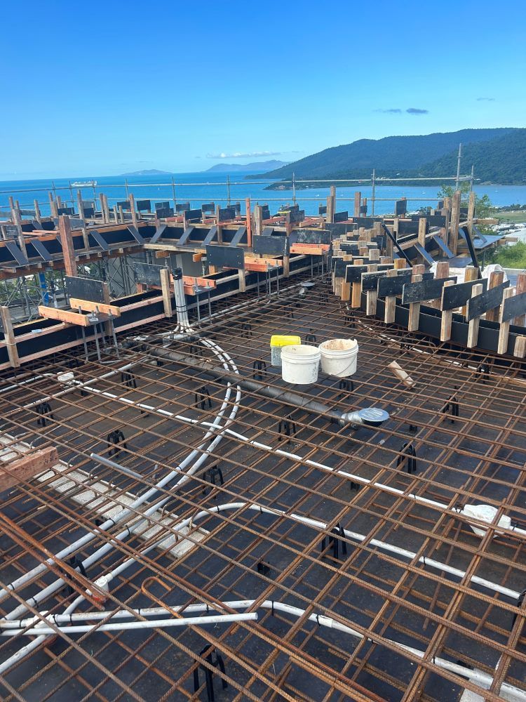 A Roof Of A Building Under Construction With A View Of The Ocean — Rock Plumbing & Gasfitting In Cannonvale, QLD