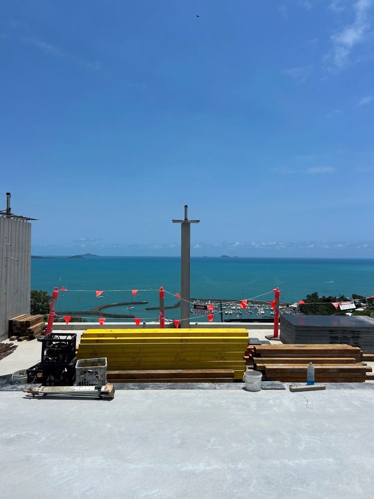 A Construction Site With A View Of The Ocean — Rock Plumbing & Gasfitting In Cannonvale, QLD