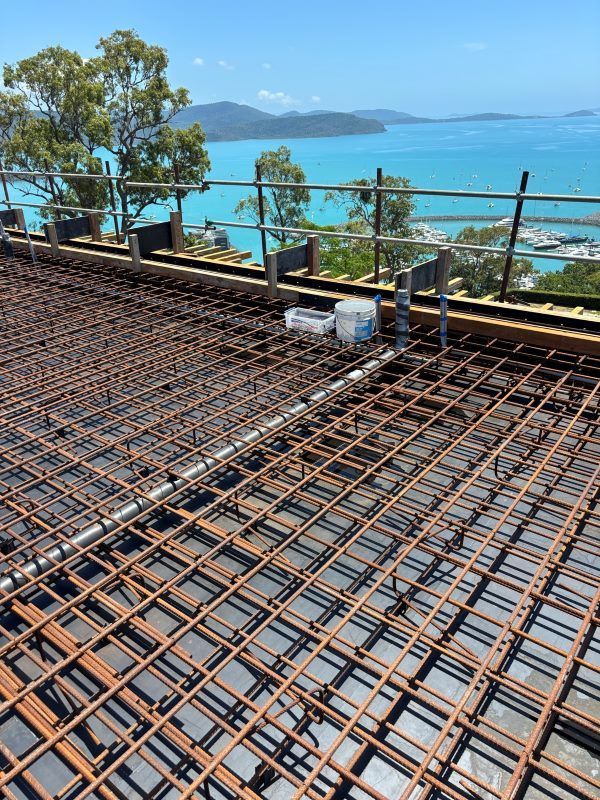 A Roof With A View Of The Ocean Is Being Built — Rock Plumbing & Gasfitting In Cannonvale, QLD