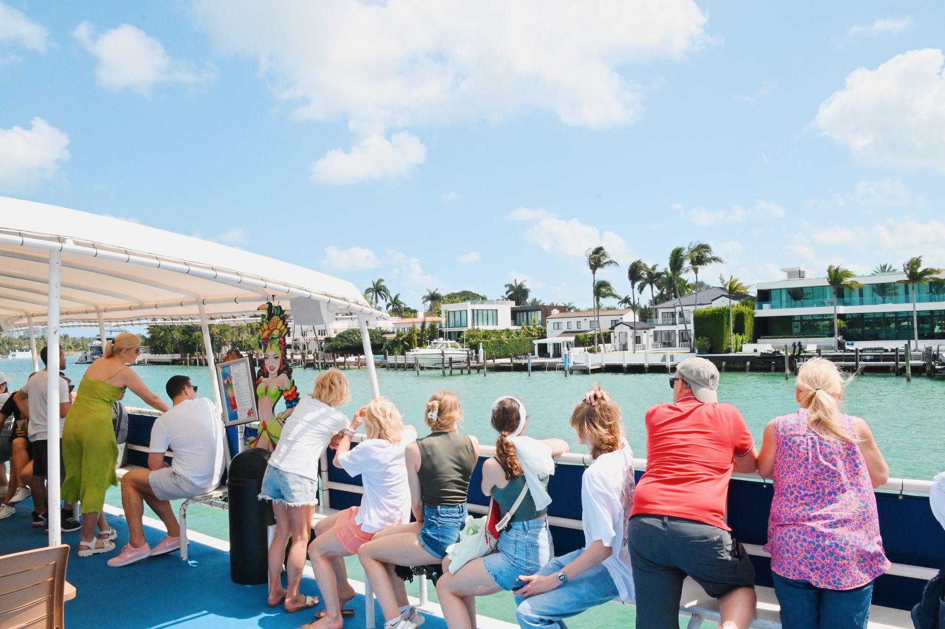 Group of passengers enjoying the Views of the Celebrity Mansions from the Water.