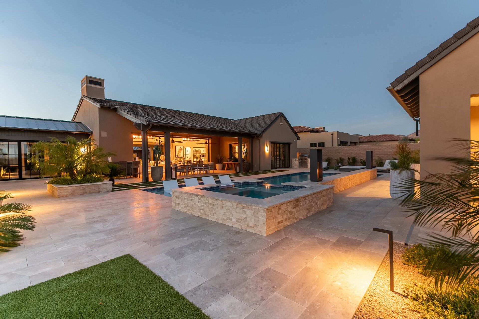 A large house with a large swimming pool in the backyard.