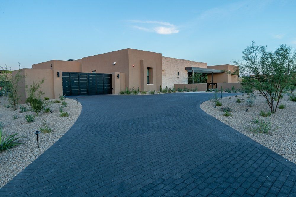 A large house with a driveway leading to it
