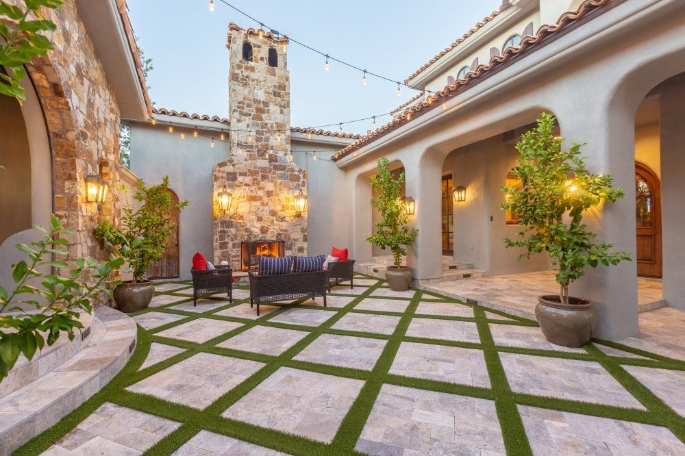 There is a fireplace in the middle of the courtyard.