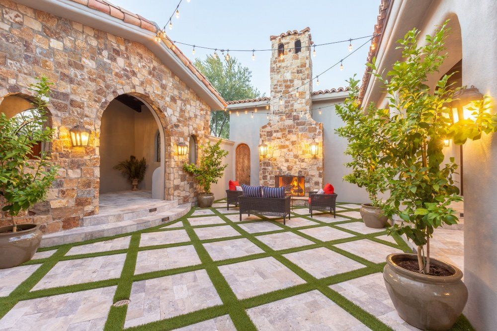 There is a fireplace in the middle of the courtyard.