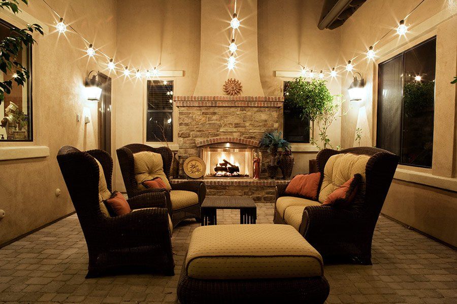 A living room with a fireplace and a lot of furniture