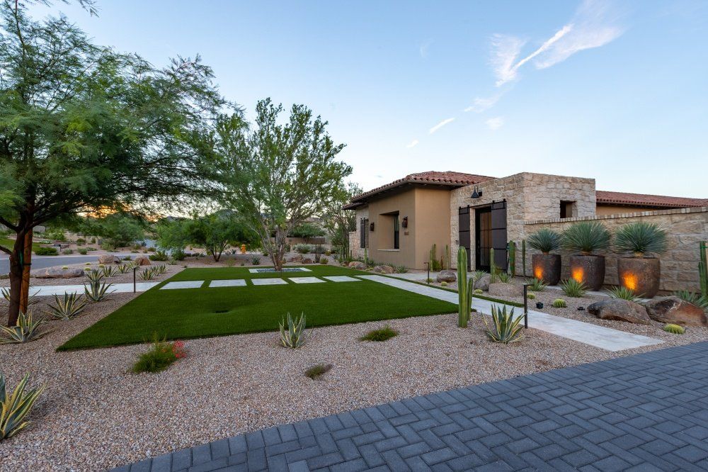 A large house with a large lawn in front of it.