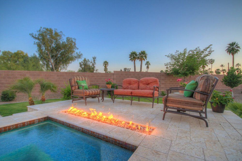 There is a fire pit in the middle of the pool.