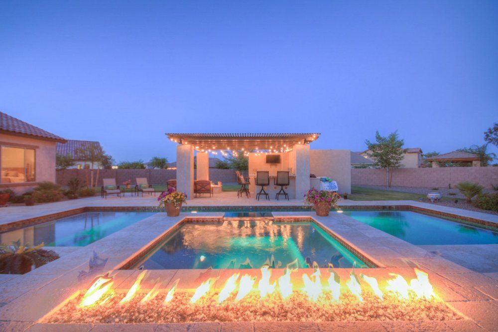 There is a fire pit in the middle of the pool.