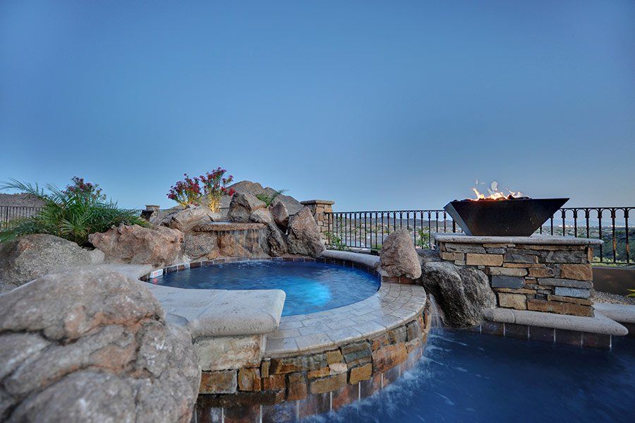 There is a fire pit in the middle of the pool.