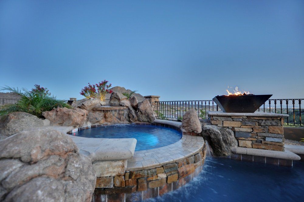 There is a fire pit in the middle of the pool.