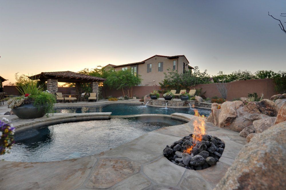 There is a fire pit in the middle of the pool.