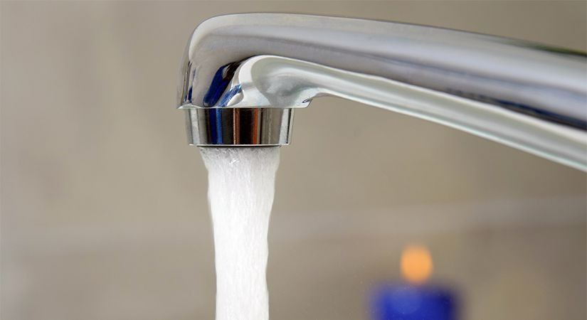 A Close Up Of A Faucet With Water Running Out Of It — Coll Plumbing Pty Ltd in Mackay, QLD