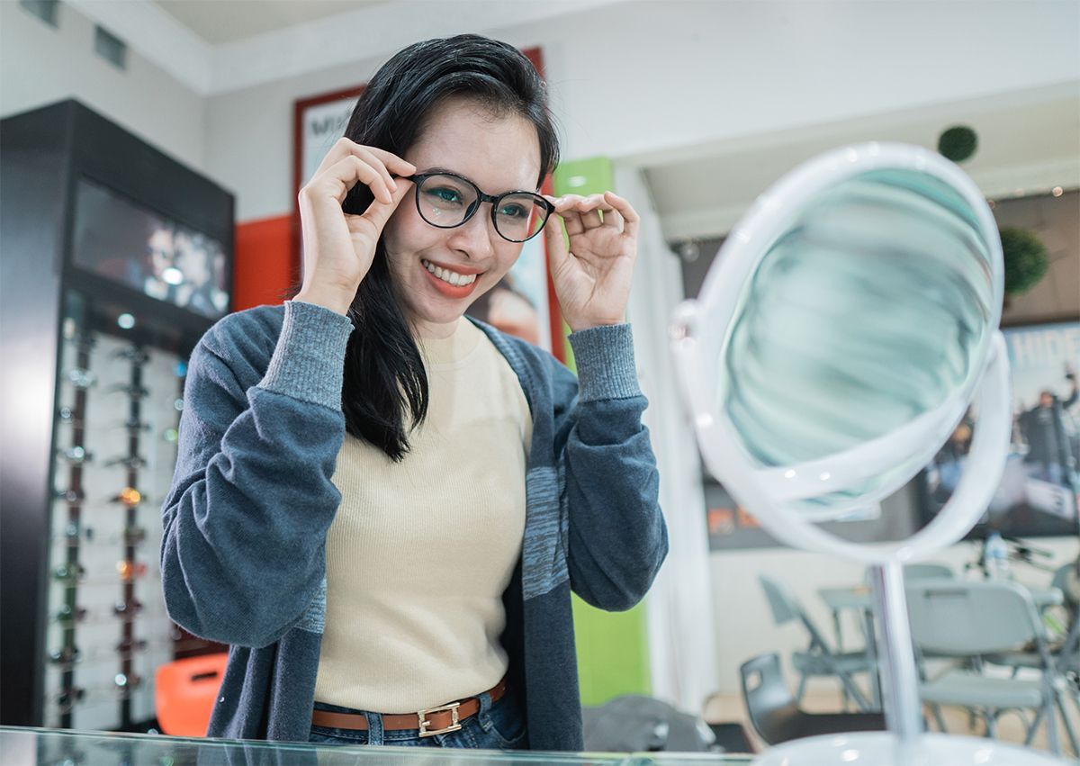 woman trying on eyeglasses