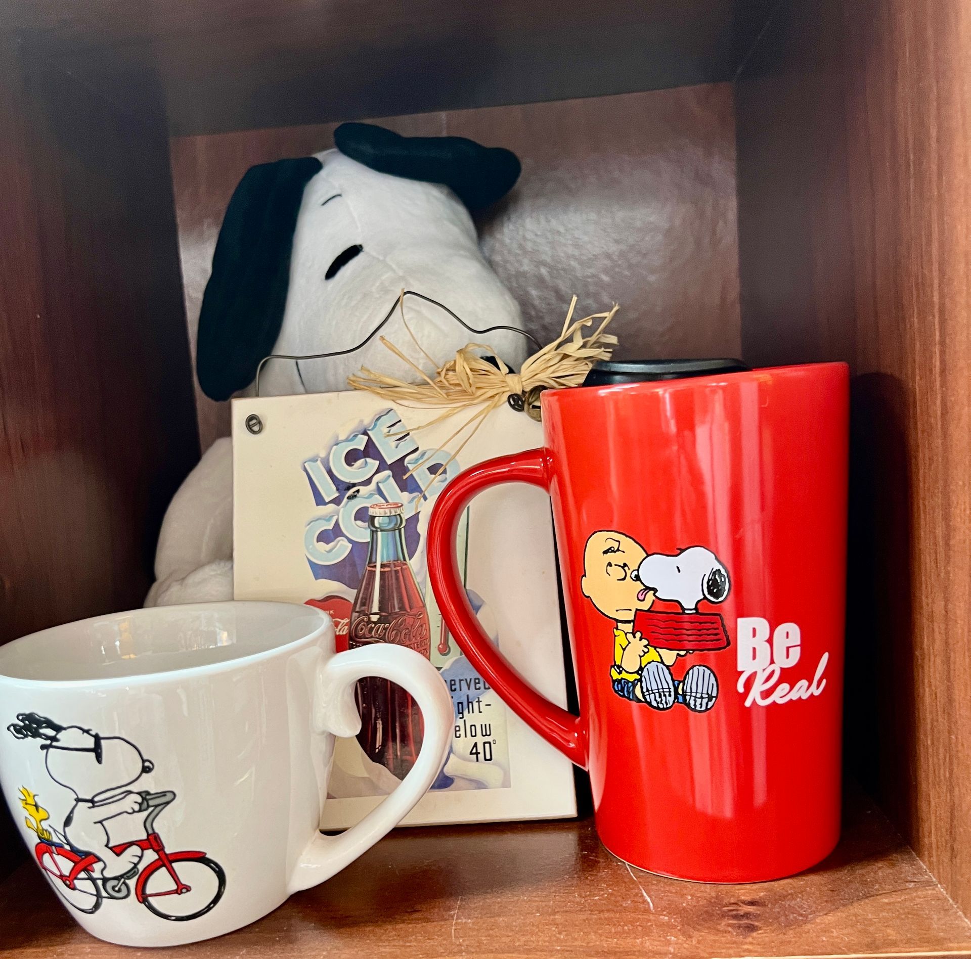 A table with lamps candles and a clock on it