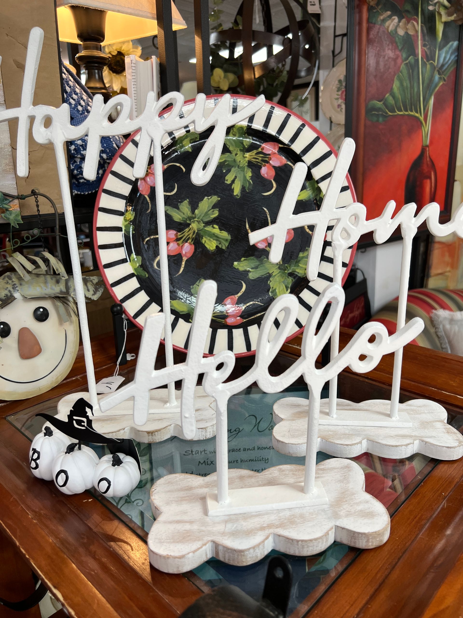 A display of cups and bowls on a table in a store.