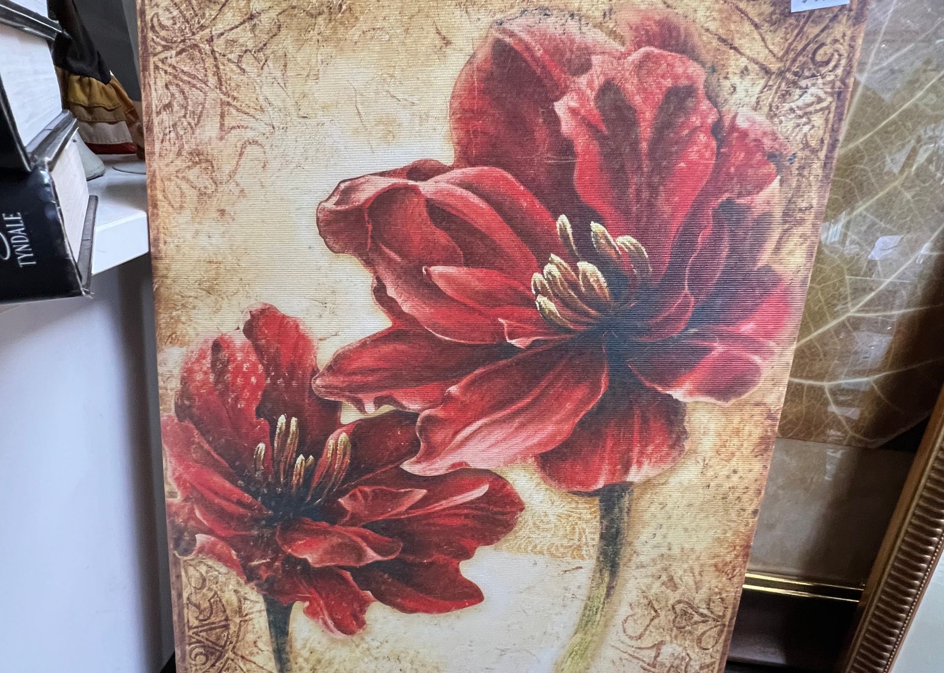A painting of two red flowers on a beige background