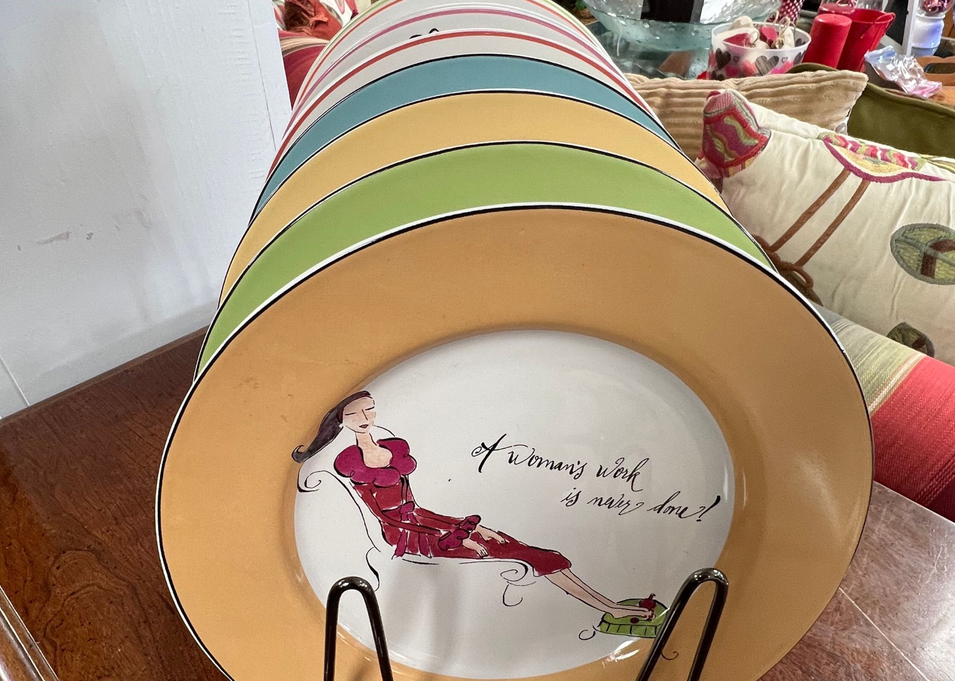 A stack of plates with a woman on them
