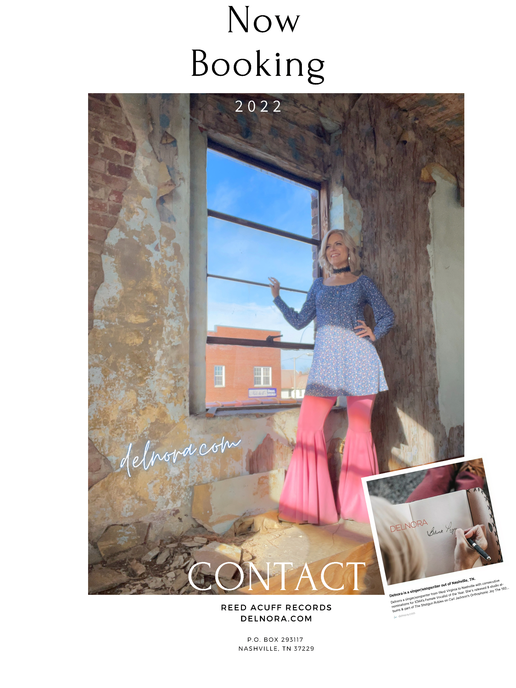 A woman in a blue dress and pink pants is standing in front of a window.