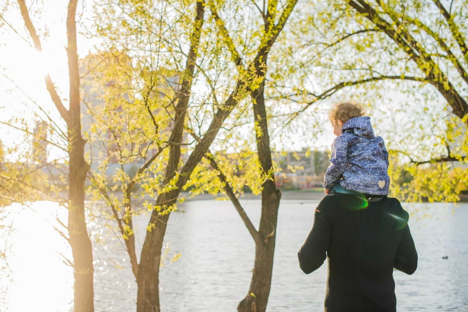 A cemetery with a stone building in the background