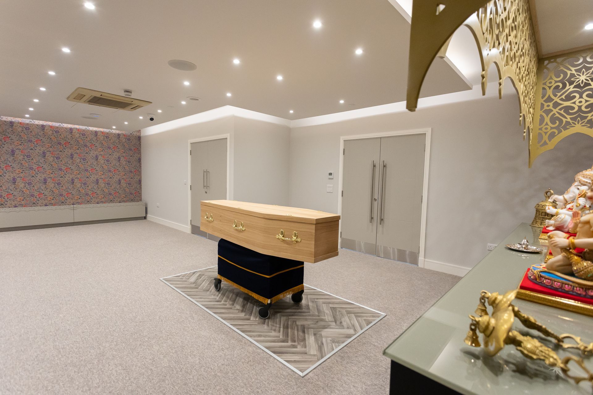 There is a coffin in the middle of the room.