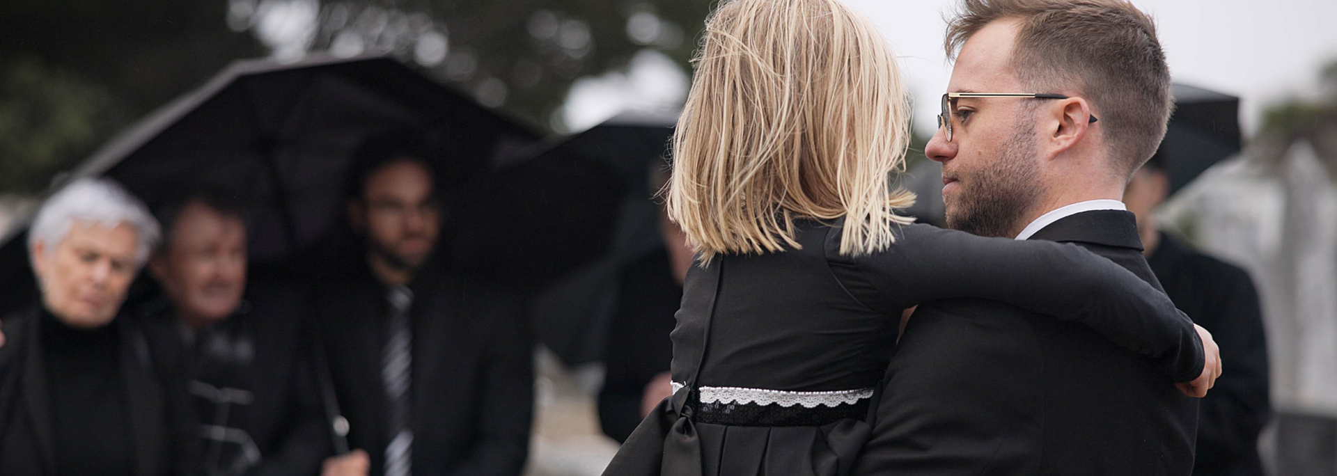 Picture of People wearing black at a funeral. Picture of People wearing black at a funeral.