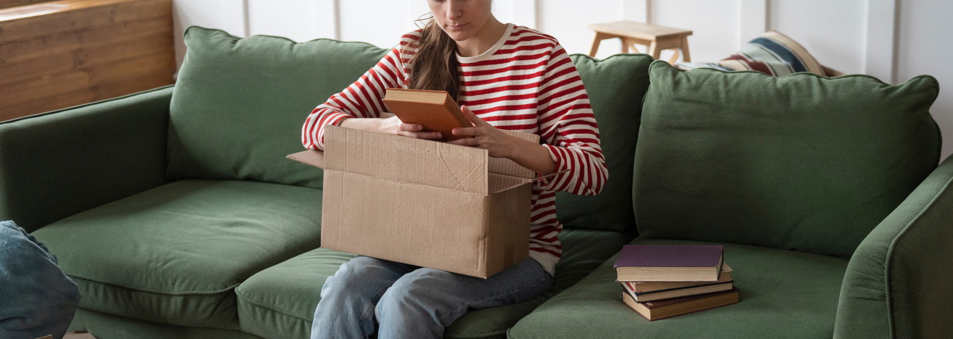 Picture of a person examining old possessions. Picture of a person examining old possessions.