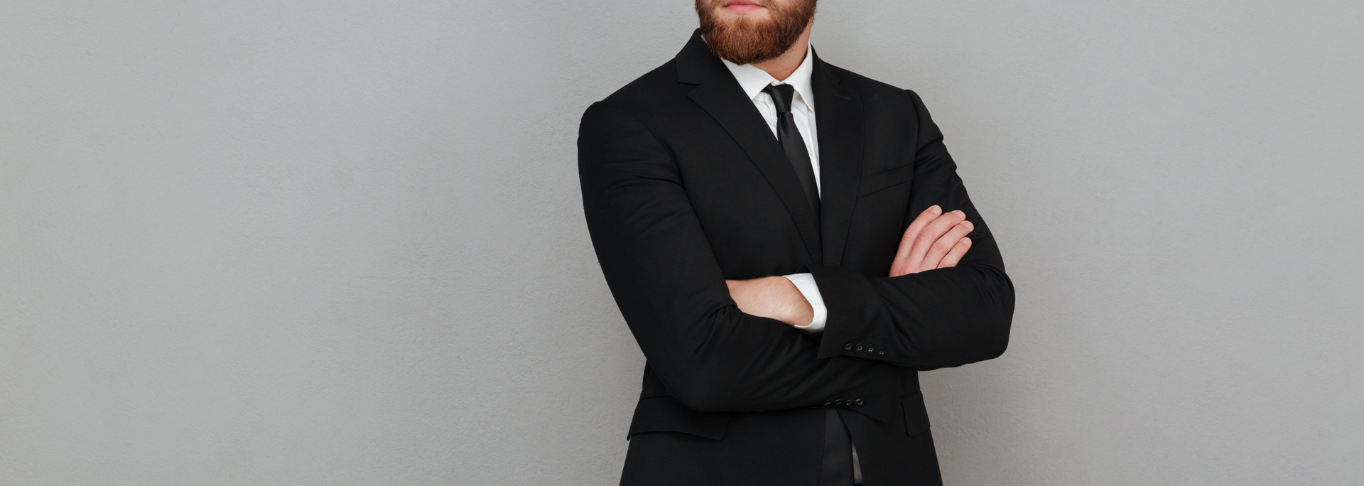 Picture of a person in a dark suit. Picture of a person in a dark suit.