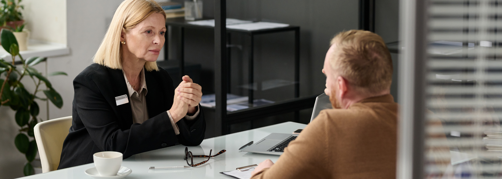 Picture of a person in a meeting with a solicitor. Picture of a person in a meeting with a solicitor.